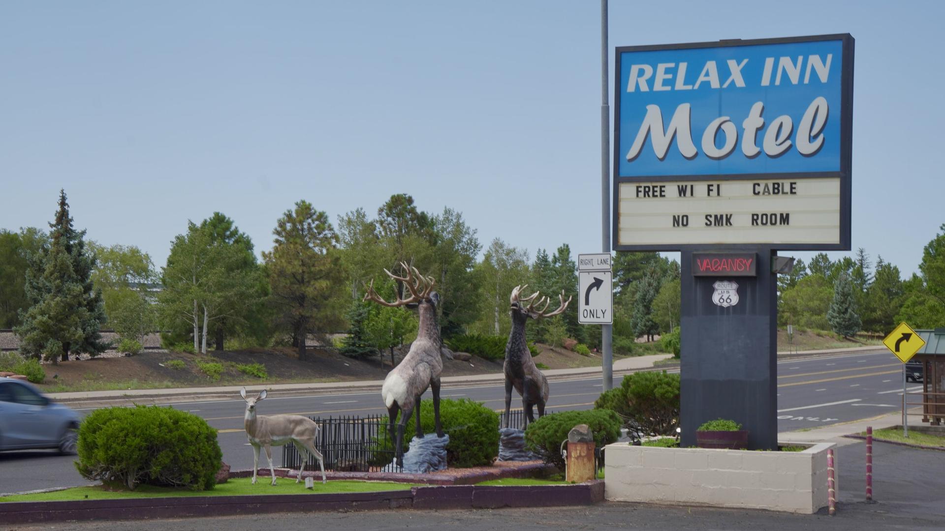 Relax Inn Motel sign with elk statues on historic Route 66