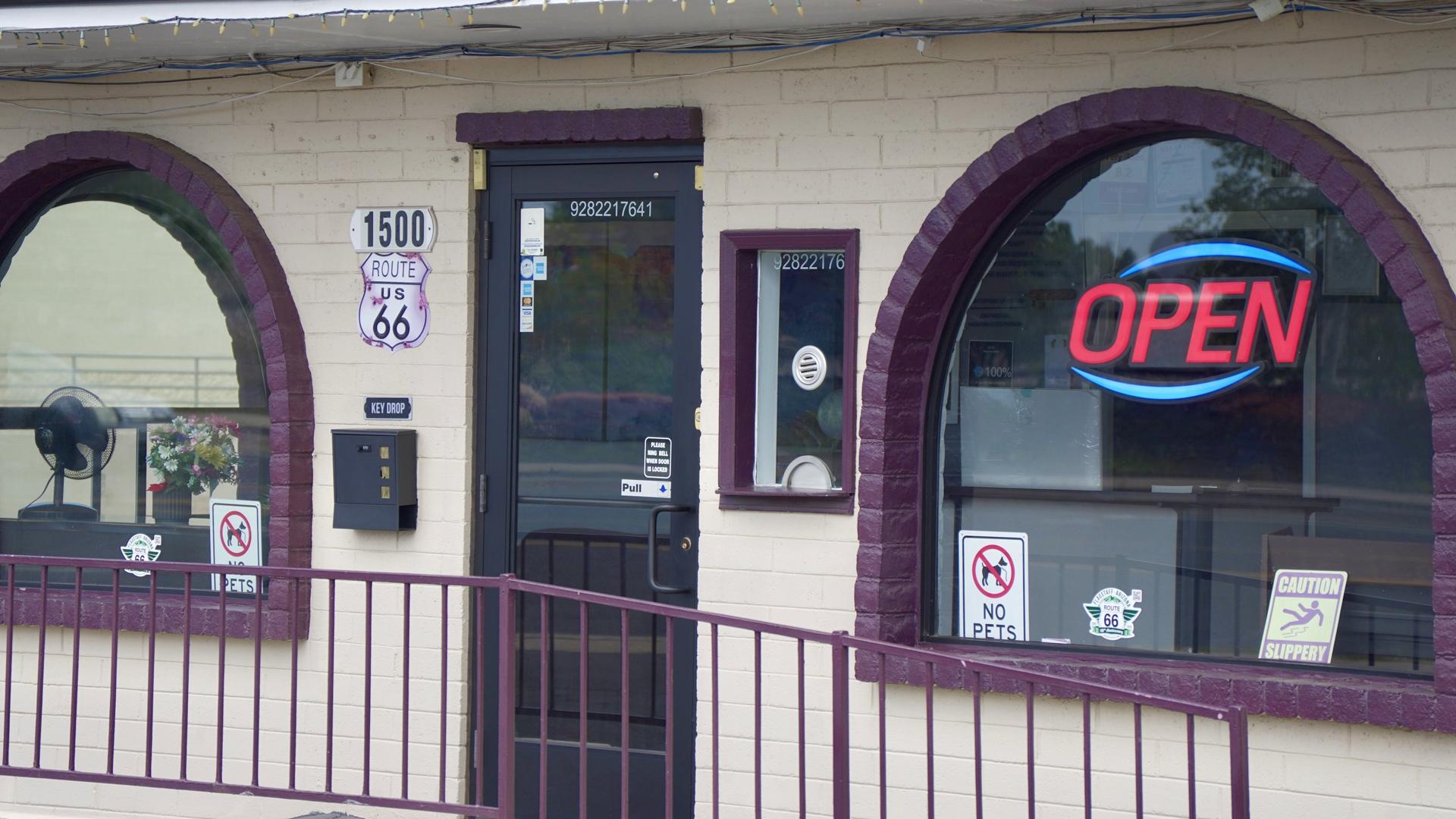 Office entrance with open sign and arched windows