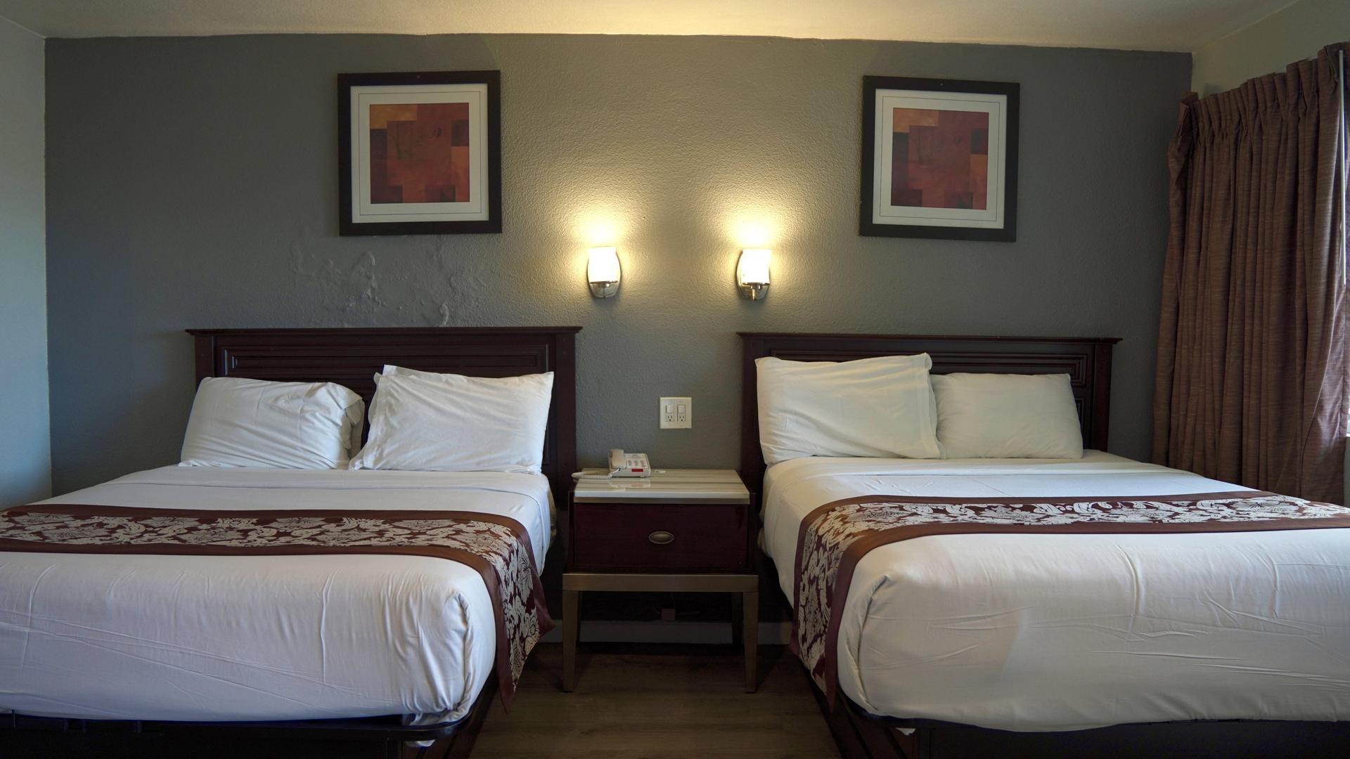 Two double beds with reading lamps