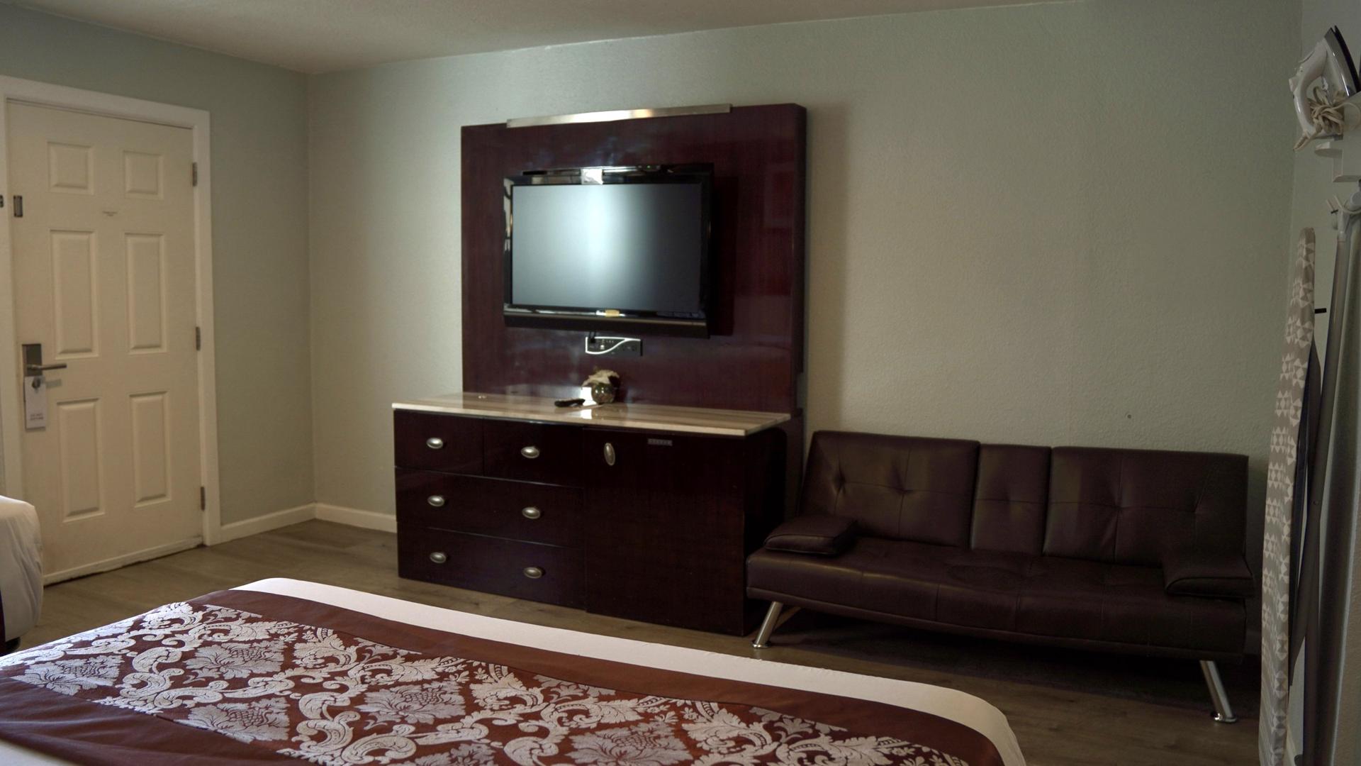 Double room with TV and sofa