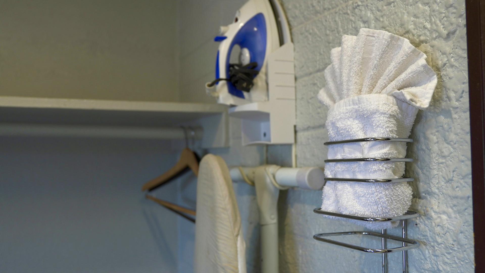 Iron, ironing board, and fresh towels