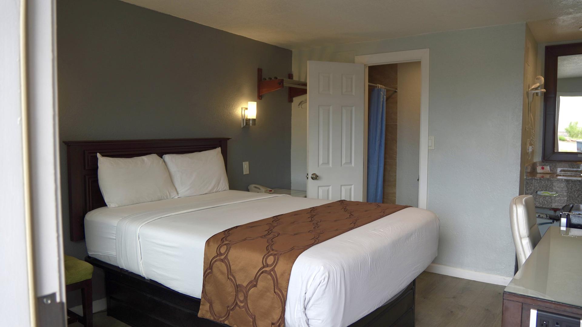 Queen bed with warm lighting