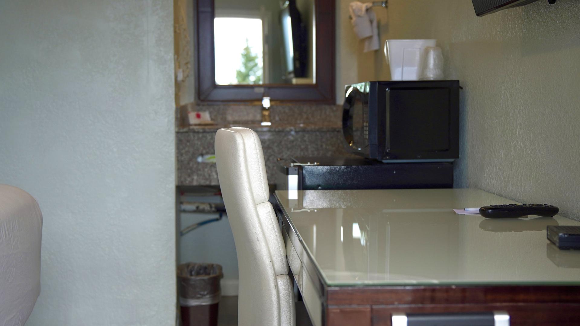 Desk, TV, and microwave corner